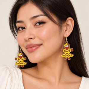 Young adult woman wearing Gingerbread Girl Embroidered Earrings