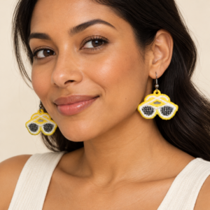 Woman wearing sunglasses embroidered earrings